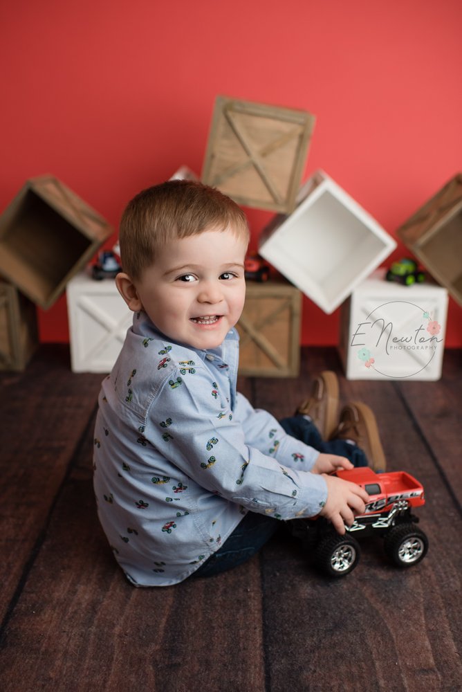 Lucas playing with monster trucks